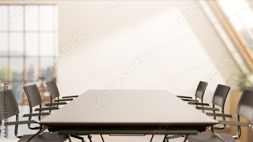 Fototapeta Naklejka Na Ścianę i Meble -  Long black table and swivel chairs in office company meeting room with sunlight through roof window.