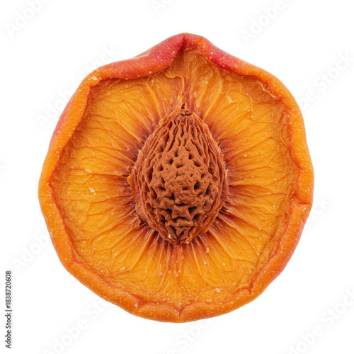 Detailed cross-section of a dried peach revealing seed and texture isolated on white background