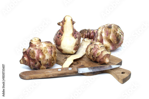 Fresh Jerusalem Artichokes On Rustic Wood Board With Knife For Home Cooking Or Kitchen Use