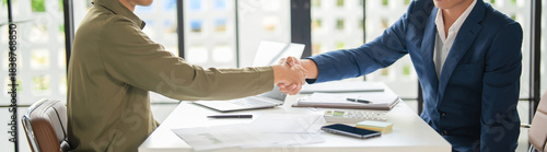Businessmen shaking hands in agreement.