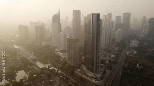 Hazy Aerial View of Jakarta's SCBD High-Rises and Mass Transit