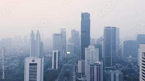 Extreme Aerial Wide Shot of Jakarta CBD Skyline Covered in Heavy Smog and Air Pollution