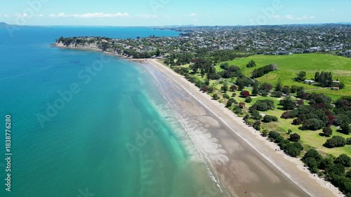Drone Aerial Over the East End of Long Bay With Distant Auckland New Zealand