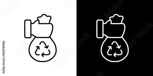 Recycling symbol on a trash bag held by a hand, icon for environmental services and sustainability efforts