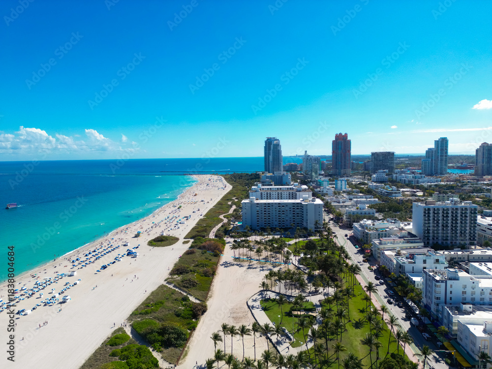 Fototapeta premium Aerial view of Miami skyline. Drone shot of Miami cityscape. Top view of South Miami and the ocean. Miami skyline with skyscrapers and coastline from top.