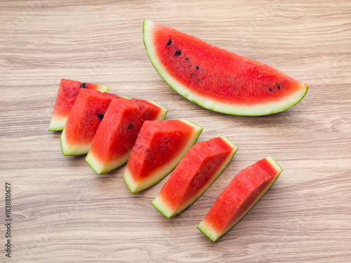 Sliced Watermelon on Wooden Background
