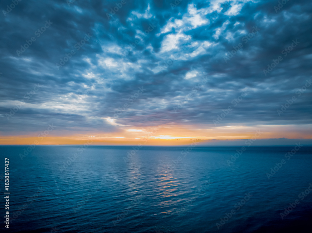 Fototapeta premium Sunrise at the Seaside with rain clouds