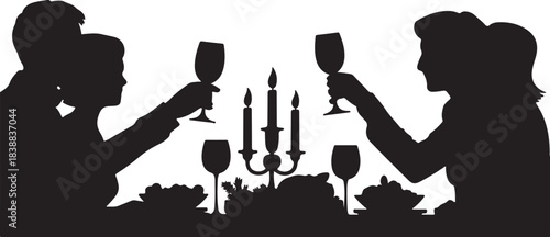Couple toasting wine glasses at candlelit dinner table