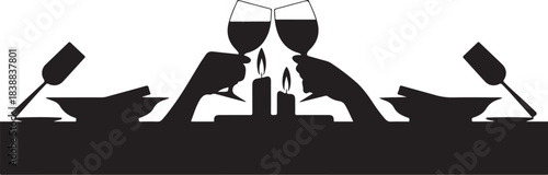 Silhouette couple toasting wine glasses by candlelight