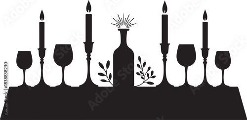 Table setting with wine glasses candles and bottle