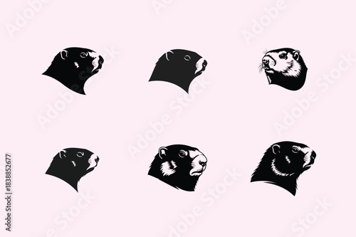 Abstract dark shapes resembling animal faces scattered on a light pink background