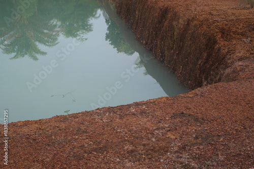 Red natural pebbles create a striking earthy texture, enhancing landscapes with vibrant color and rustic beauty.