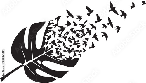 Black silhouette of a leaf transforming into flying birds