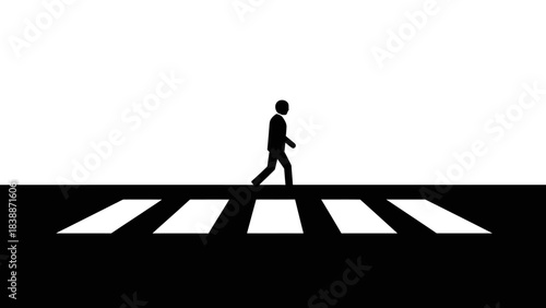 A solitary figure walks across a stark black and white crosswalk, emphasizing the contrast between light and shadow.