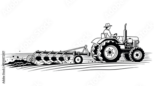 Farmer plowing field with tractor