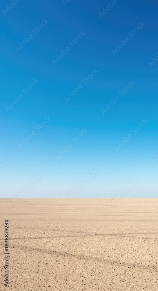 Fototapeta premium A wide, expansive empty plain under a clear blue sky, symbolizing potential and the concept of freedom, ready for new journeys and decisions ,serene ,freedom ,outdoor