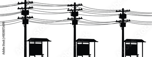 Row of silhouetted utility poles with transformers and bus stop shelters power lines