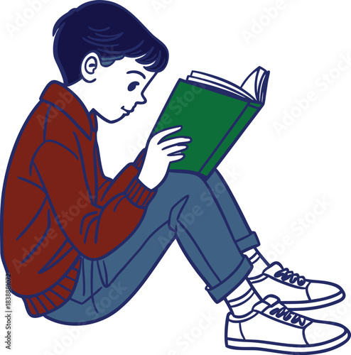 Young boy engrossed in reading a green book