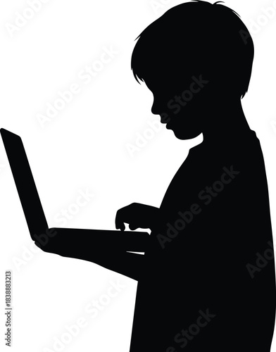 Silhouette of a boy using a portable computer device