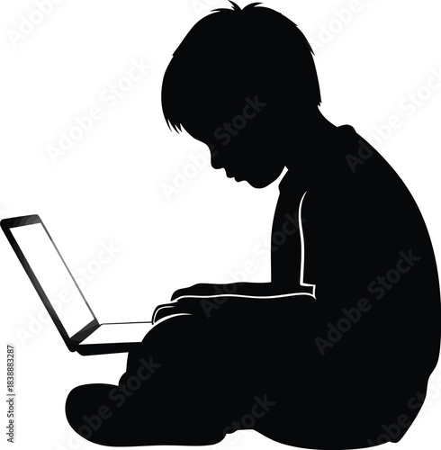 Silhouette of a child using a laptop with focused attention