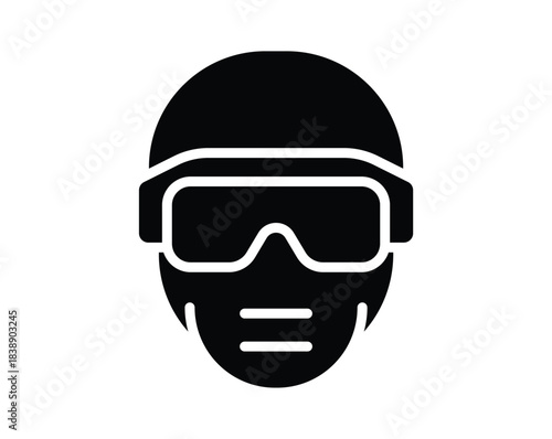 Silhouette of a person wearing protective goggles and face mask