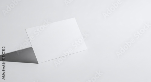 Clean Blank White Card Standing Upright on a Minimalist White Surface