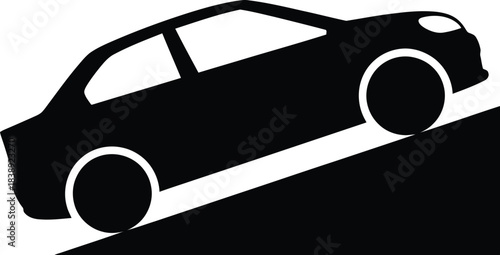 Silhouette of a car driving up a steep incline