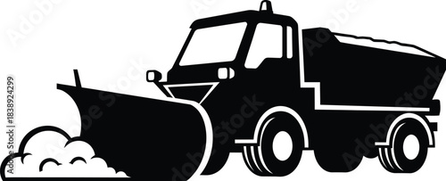 Silhouette of a snow plow truck clearing winter roads