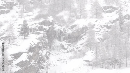 Heavy snowfall in the Alps mountains, Italy landscape