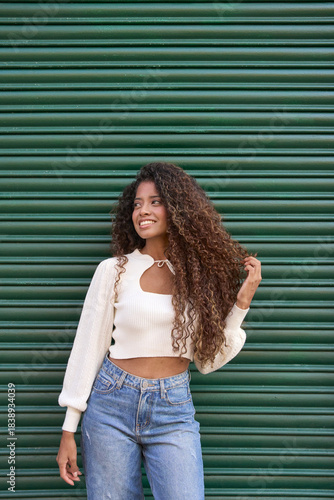 Young woman smiling, enjoying urban lifestyle and freedom