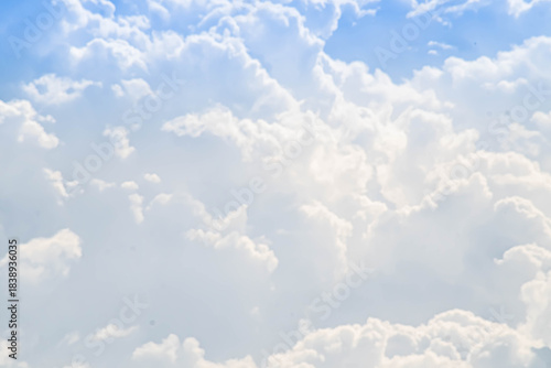  Fluffy White Clouds Drifting in a Bright Blue Sky
