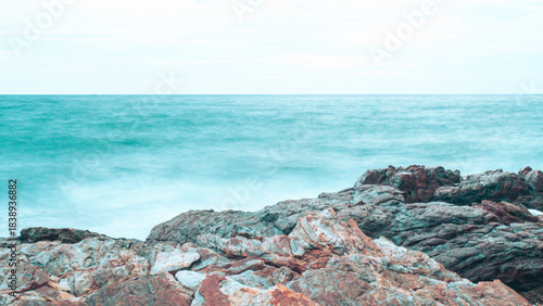 Rocky Australian coastline with crystal clear waters and waves