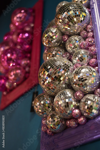 Mirror shiny ball on a pink background. Disco ball	