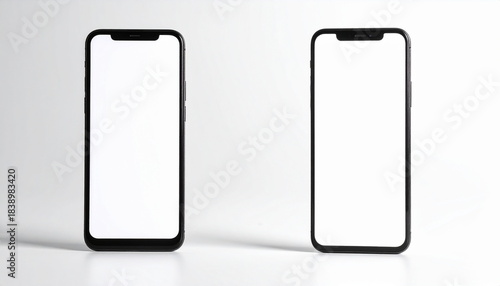 ライトグレー背景に直立する2つの白抜き画面のスマートフォンのモックアップ　白いディスプレイのスマホ