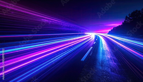 Long exposure captures vibrant streaks of light along a highway at dusk
