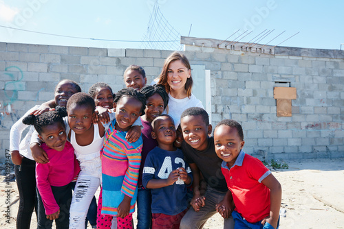 фотографія Poverty, volunteer and portrait of children outdoor for ngo organization, education drive and support