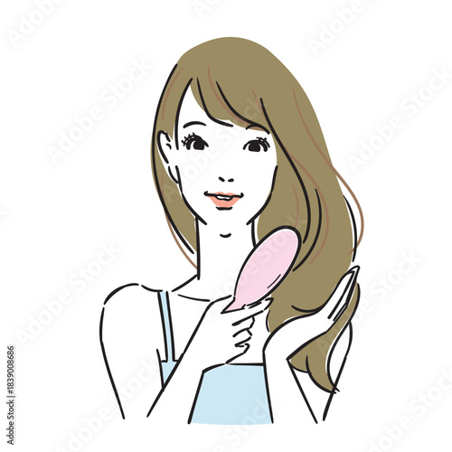 ロングヘアの可愛い女性上半身ヘアケア