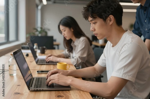 couple using laptop in kitchen