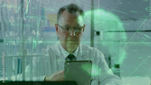 Senior scientist tapping tablet in lab generating green hologram waveforms and globe analyzing data