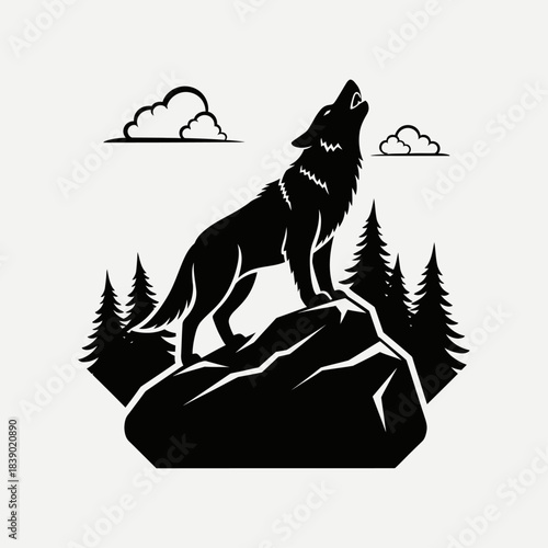 Silhouette of howling wolf on a rock peak at night