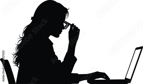 Silhouette of woman working on laptop while adjusting glasses, representing focus, concentration, office work, remote job and digital tasks