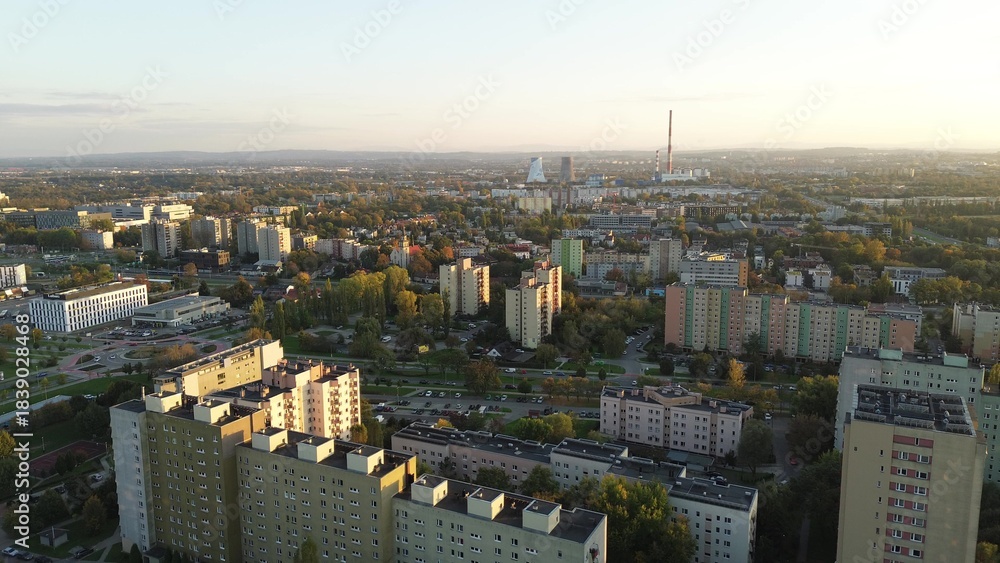 Fototapeta premium Apartment complex with sunset city backdrop