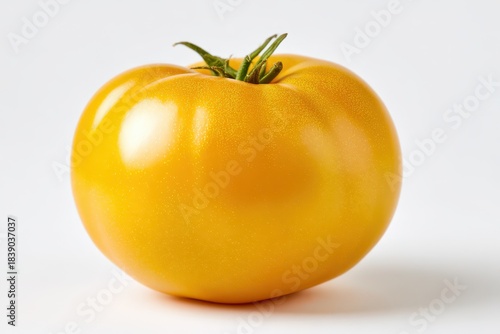 Wallpaper Mural Bright yellow tomato in a minimal still-life on a white surface Torontodigital.ca