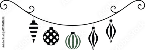 Black and white Christmas ornaments on a curved string