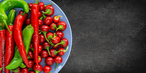 Red, hot chili pepper composition, spicy organic paprika and different seasonings background