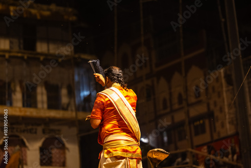 Ganga aarti, Group of young male priest performing holy river ganga evening aarti at dashashwamedh ghat in traditional dress with hindu rituals.