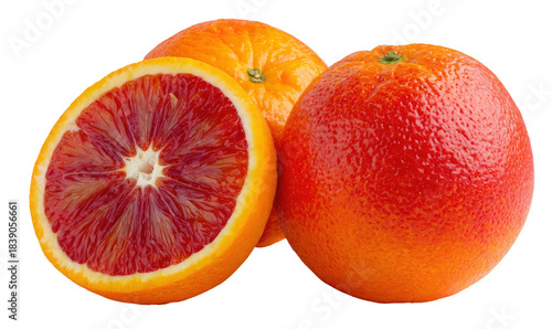 Three vibrant blood oranges with one cut in half revealing red flesh isolated on transparent background