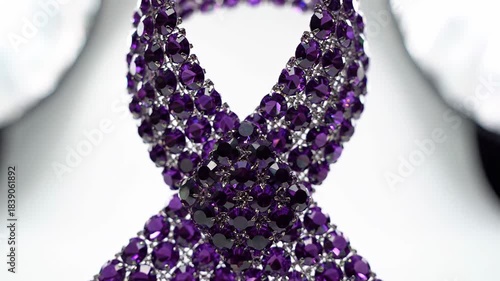 Purple Awareness Ribbon Made of Sparkling Gems on White Background.