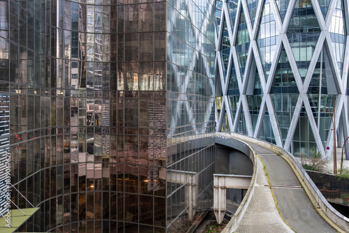 Wallpaper Mural Modern architecture skyscraper rising in the urban district of La Defense, showing business and finance energy across Paris with tower forms shaping the skyline of the city Torontodigital.ca