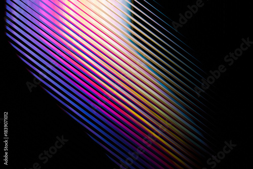 Abstract diagonal lines with vibrant gradient colors and subtle light reflections on a dark background